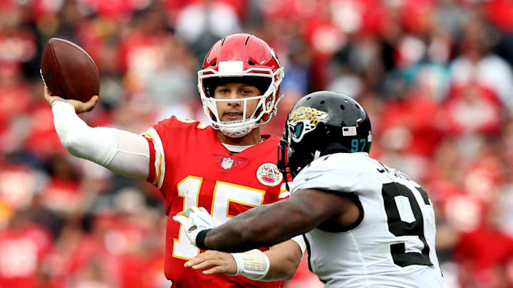 KANSAS CITY, MO - OCTOBER 07: Quarterback Patrick Mahomes #15 of the Kansas City Chiefs passes as Malik Jackson #97 of the Jacksonville Jaguars chases during the game at Arrowhead Stadium on October 7, 2018 in Kansas City, Missouri. (Photo by Jamie Squire/Getty Images)