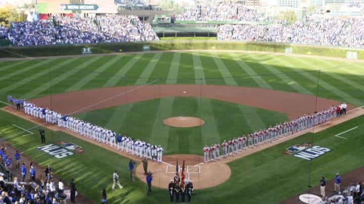 Oct 12, 2015; Chicago, IL, USA; The Chicago Cubs and St. Louis Cardinals on the field during the national anthem before game three of the NLDS at Wrigley Field. Mandatory Credit: Caylor Arnold-USA TODAY Sports