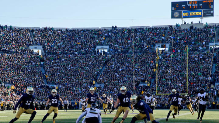 SOUTH BEND, IN - NOVEMBER 14: Tabari Hines #6 of the Wake Forest Demon Deacons lets a punt bounce as the Notre Dame Fighting Irish close in for the tackle during the first quarter at Notre Dame Stadium on November 14, 2015 in South Bend, Indiana. The Notre Dame Fighting Irish won 28-7. (Photo by Jon Durr/Getty Images)