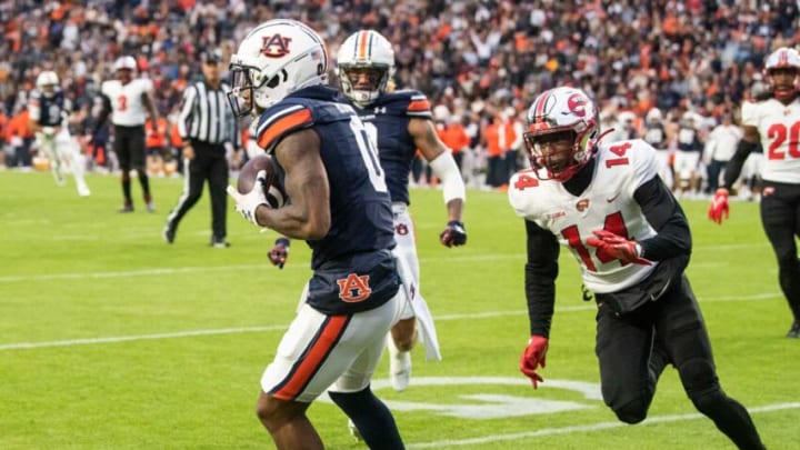 Auburn football wide receiver Koy Moore (0) catches the ball in the end zone for a touchdown as Auburn Tigers take on Western Kentucky Hilltoppers at Jordan-Hare Stadium in Auburn, Ala., on Saturday, Nov. 19, 2022. Auburn Tigers and Western Kentucky Hilltoppers are tied 17-17 at halftime.