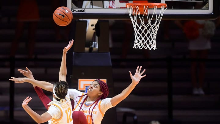 Tennessee’s Tamari Key (20) and Tennessee’s Rae Burrell (12) block an Arkansas shot during a game between the Lady Vols and Arkansas in Thompson-Boling Arena, Thursday, Jan. 7, 2021. The Lady Vols defeated Arkansas 88-73.