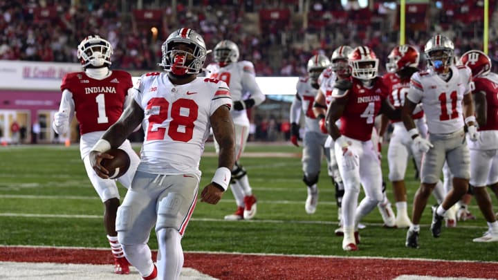 Oct 23, 2021; Bloomington, Indiana, USA; Ohio State Buckeyes running back Miyan Williams (28) runs the ball in for at touchdown against the Indiana Hoosiers during the first quarter at Memorial Stadium. Mandatory Credit: Marc Lebryk-USA TODAY Sports