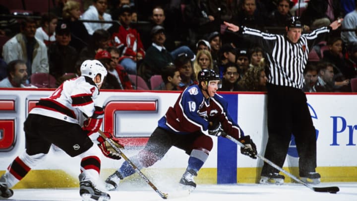 Unknown Date, 2000; East Rutherford, NJ, USA; FILE PHOTO; Colorado Avalanche center Joe Sakic (19) in action against the New Jersey Devils defensemen Scott Stevens (4) at Continental Airlines Arena. Mandatory Credit: Lou Capozzola-USA TODAY NETWORK
