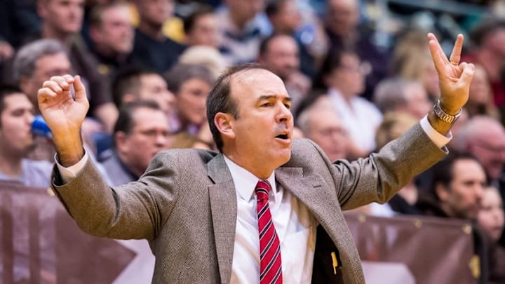 Feb 13, 2016; St. Bonaventure, NY, USA; George Washington Colonials head coach Mike Lonergan calls a play from the sidelines against the St. Bonaventure Bonnies during the first half at the Reilly Center. Mandatory Credit: Rich Barnes-USA TODAY Sports