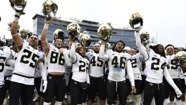 DURHAM, NORTH CAROLINA - NOVEMBER 24: The Wake Forest Demon Deacons celebrate their victory over the Duke Blue Devils following their football game at Wallace Wade Stadium on November 24, 2018 in Durham, North Carolina. (Photo by Mike Comer/Getty Images)
