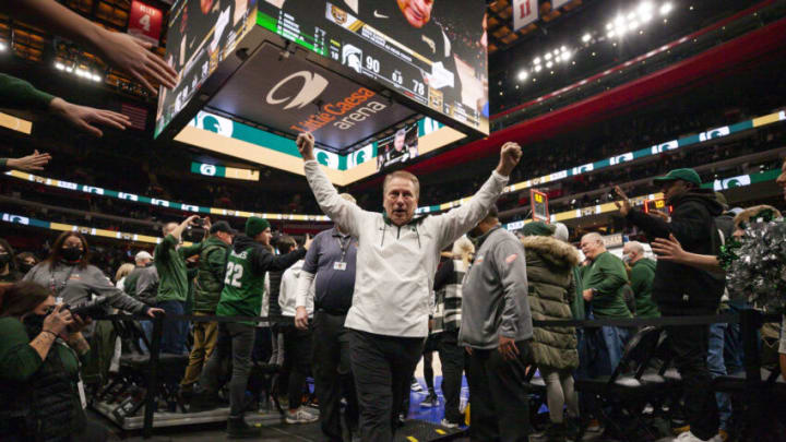Dec 21, 2021; Detroit, Michigan, USA; Michigan State Spartans head coach Tom Izzo raises his hands in victory as he walks to the locker room after the game against the Oakland Golden Grizzlies at Little Caesars Arena. Mandatory Credit: Raj Mehta-USA TODAY Sports