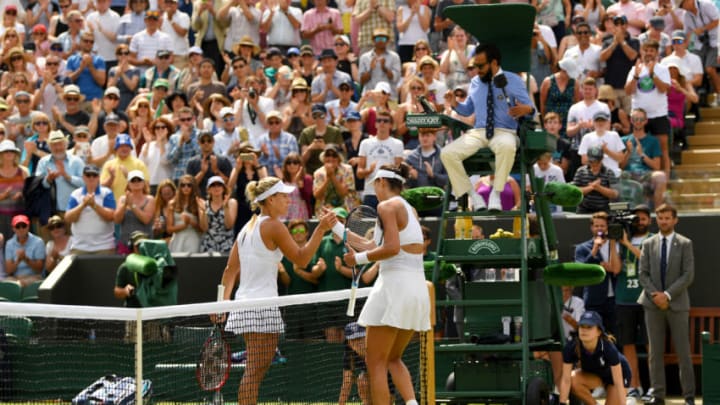 LONDON, ENGLAND - JULY 10: Garbine Muguruza of Spain and Angelique Kerber of Germany shake hands after the Ladies Singles fourth round match on day seven of the Wimbledon Lawn Tennis Championships at the All England Lawn Tennis and Croquet Club on July 10, 2017 in London, England. (Photo by Shaun Botterill/Getty Images)