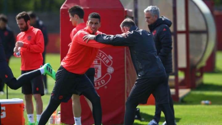 MANCHESTER, ENGLAND - MAY 03: Chris Smalling and Wayne Rooney of Manchester United stretch on during a training session at the Aon Training Complex on May 3, 2017 in Manchester, England. (Photo by Alex Livesey/Getty Images)