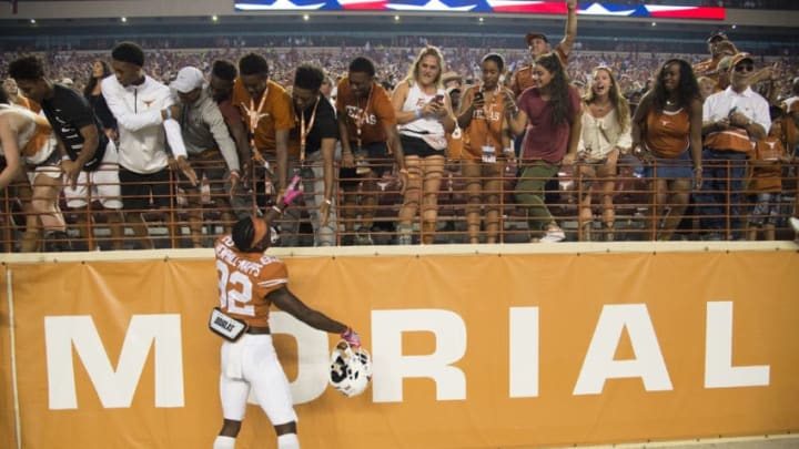 AUSTIN, TX - OCTOBER 29: Reggie Hemphill-Mapps #82 of the Texas Longhorns celebrates with fans after defeating the Baylor Bears on October 29, 2016 at Darrell K Royal-Texas Memorial Stadium in Austin, Texas. (Photo by Cooper Neill/Getty Images)