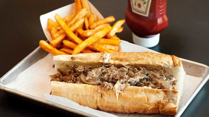 Barry’s Cheesesteaks’ mushroom cheesesteak sandwich starts with an 8-inch white Italian bread roll. Shaved beef is then sauteed in mushroom juice.