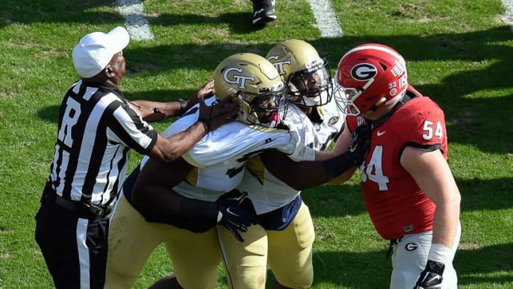 Nov 28, 2015; Atlanta, GA, USA; Georgia Tech Yellow Jackets defensive lineman Patrick Gamble (91) and linebacker P.J. Davis (40) shove with Georgia Bulldogs center Brandon Kublanow (54) after a play during the first quarter at Bobby Dodd Stadium. Mandatory Credit: Dale Zanine-USA TODAY Sports