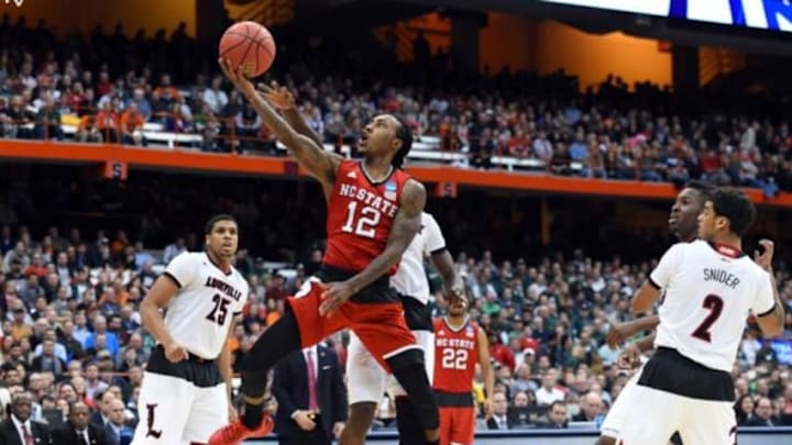 Mar 27, 2015; Syracuse, NY, USA; North Carolina State Wolfpack guard Anthony Barber (12) shoots the ball during the second half against the Louisville Cardinals in the semifinals of the east regional of the 2015 NCAA Tournament at Carrier Dome. Mandatory Credit: Rich Barnes-USA TODAY Sports