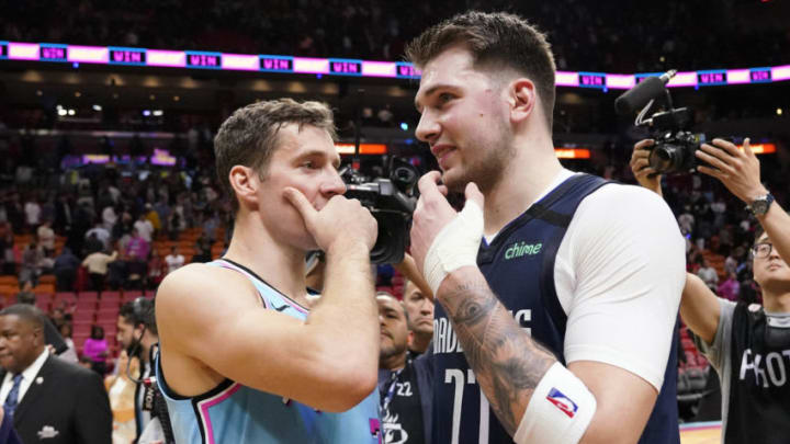 Miami Heat guard Goran Dragic (7) talks with Dallas Mavericks guard Luka Doncic (77)(Steve Mitchell-USA TODAY Sports)