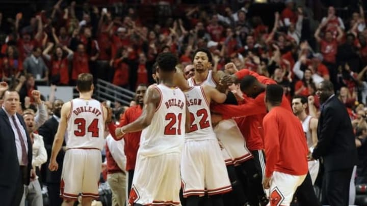 May 8, 2015; Chicago, IL, USA; Chicago Bulls guard Derrick Rose (center) is lifted up by his teammates after hitting the game winning shot against the Cleveland Cavaliers during game three of the second round of the NBA Playoffs. at the United Center. The Chicago Bulls defeated the Cleveland Cavaliers 99-96. Mandatory Credit: David Banks-USA TODAY Sports