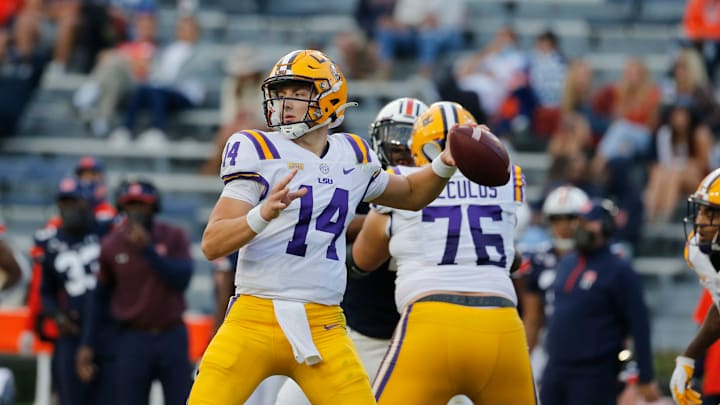 Oct 31, 2020; Auburn, Alabama, USA; LSU Tigers quarterback Max Johnson (14) looks for a receiver against the Auburn Tigers during the third quarter at Jordan-Hare Stadium. Mandatory Credit: John Reed-USA TODAY Sports