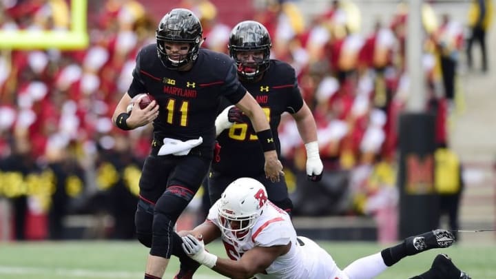 Nov 26, 2016; College Park, MD, USA; Maryland Terrapins quarterback Perry Hills (11) runs with the ball past Rutgers Scarlet Knights defensive lineman Julian Pinnix-Odrick (53) in the fourth quarter at Capital One Field at Maryland Stadium. The Terrapins won 31-13. Mandatory Credit: Patrick McDermott-USA TODAY Sports