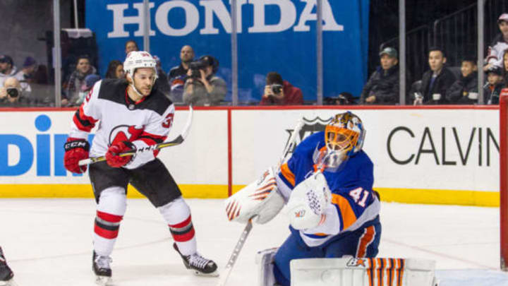 BROOKLYN, NY – JANUARY 07: New York Islanders Goalie Jaroslav Halak (41) gloves a shot by New Jersey Devils Winger Brian Gibbons (39) during the first period of a Metropolitan Division match-up between the New Jersey Devils and the New York Islanders on January 07, 2018, at Barclays Center in Brooklyn, NY. (Photo by David Hahn/Icon Sportswire via Getty Images)