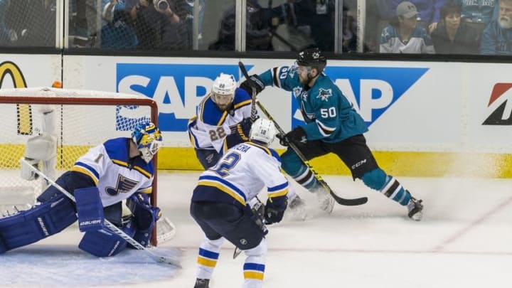 May 25, 2016; San Jose, CA, USA; San Jose Sharks center Chris Tierney (50) collides with St. Louis Blues defenseman Kevin Shattenkirk (22) as St. Louis Blues goalie Brian Elliott (1) defends in the second period of game six in the Western Conference Final of the 2016 Stanley Cup Playoffs at SAP Center at San Jose. Mandatory Credit: John Hefti-USA TODAY Sports