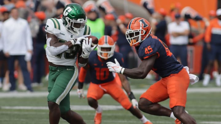 Oct 2, 2021; Champaign, Illinois, USA; Charlotte 49ers running back Shadrick Byrd (13) makes a reception in front of Illinois Fighting Illini linebacker Khalan Tolson (45) in the second half at Memorial Stadium. Mandatory Credit: Ron Johnson-USA TODAY Sports