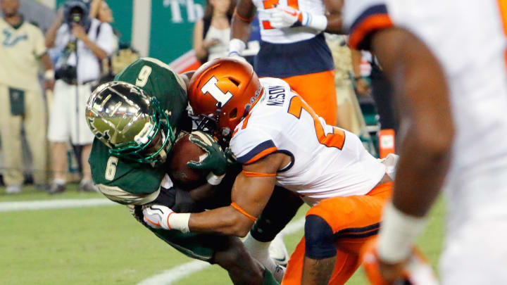 TAMPA, FL – SEPTEMBER 15: Running back Darius Tice #6 of the South Florida Bulls drags defensive back Patrick Nelson #21 of the Illinois Fighting Illini into the endzone for the team’s touchdown during the second quarter at Raymond James Stadium on September 15, 2017 in Tampa, Florida. (Photo by Joseph Garnett Jr. /Getty Images)