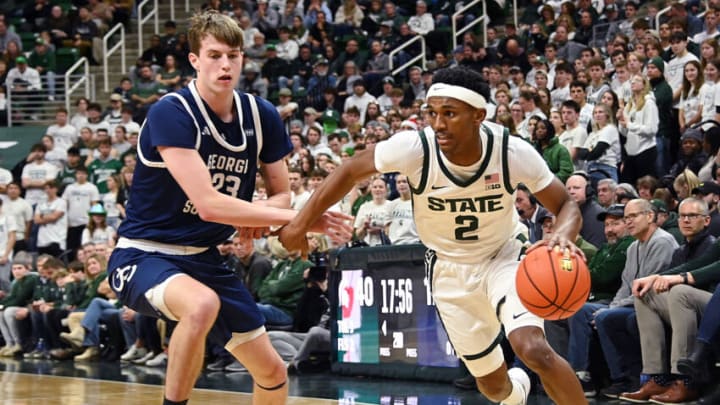 Nov 28, 2023; East Lansing, Michigan, USA; Michigan State Spartans guard Tyson Walker (2) drives past Georgia Southern Eagles forward Nate Brafford (23) during the second half at Jack Breslin Student Events Center. Mandatory Credit: Dale Young-USA TODAY Sports