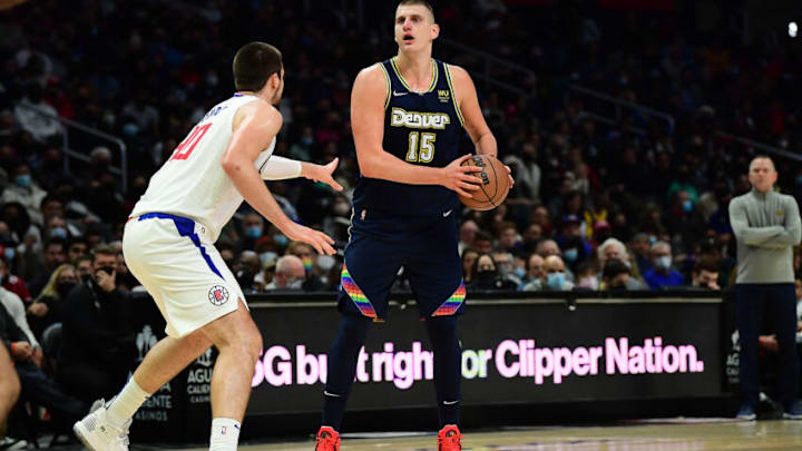 Denver Nuggets center Nikola Jokic (15) controls the ball against Los Angeles Clippers center Ivica Zubac (40) during the second half at Crypto.com Arena on 26 Dec. 2021. (Gary A. Vasquez-USA TODAY Sports)