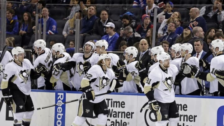 Mar 27, 2016; New York, NY, USA; Pittsburgh Penguins right wing Phil Kessel (81) celebrates with teammates after scoring a goal during the second period against the New York Rangers at Madison Square Garden. Mandatory Credit: Adam Hunger-USA TODAY Sports