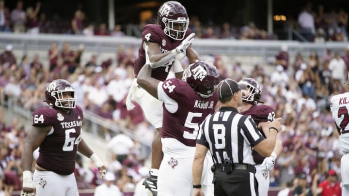 Oct 28, 2023; College Station, Texas, USA; Texas A&M Aggies running back Amari Daniels (4) and offensive lineman Mark Nabou Jr. (54) celebrate during the second quarter against the South Carolina Gamecocks at Kyle Field. Mandatory Credit: Dustin Safranek-USA TODAY Sports