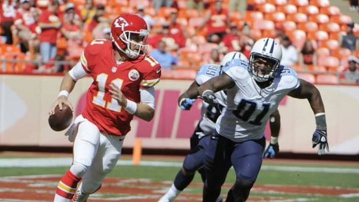 Sep 7, 2014; Kansas City, MO, USA; Kansas City Chiefs quarterback Alex Smith (11) is chased by Tennessee Titans linebacker Derrick Morgan (91) in the second half at Arrowhead Stadium. Tennessee won the game 26-10. Mandatory Credit: John Rieger-USA TODAY Sports Sep 7, 2014; Kansas City, MO, USA; Kansas City Chiefs quarterback Alex Smith (11) is chased by Tennessee Titans linebacker Derrick Morgan (91) in the second half at Arrowhead Stadium. Tennessee won the game 26-10. Mandatory Credit: John Rieger-USA TODAY Sports