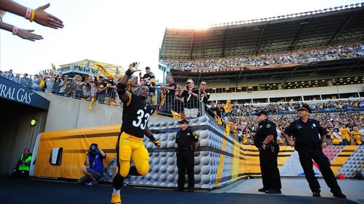 Sep 16, 2012; Pittsburgh , PA, USA; Pittsburgh Steelers running back Isaac Redman (33) runs out of the tunnel before the game against the New York Jets at Heinz Field. The Steelers won the game, 27-10. Mandatory Credit: Jason Bridge-USA TODAY Sports