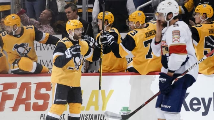 PITTSBURGH, PA - JANUARY 08: Pittsburgh Penguins Right Wing Bryan Rust (17) celebrates his goal with the bench during the second period in the NHL game between the Pittsburgh Penguins and the Florida Panthers on January 8, 2019, at PPG Paints Arena in Pittsburgh, PA. (Photo by Jeanine Leech/Icon Sportswire via Getty Images)
