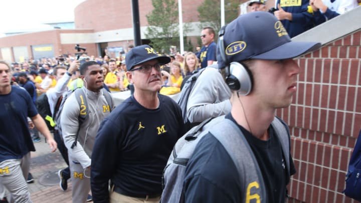ANN ARBOR, MI - OCTOBER 07: Michigan Wolverines head football coach Jim Harbaugh enters the stadium prior to the start of the game against Michigan State Spartans at Michigan Stadium on October 7, 2017 in Ann Arbor, Michigan. (Photo by Leon Halip/Getty Images)