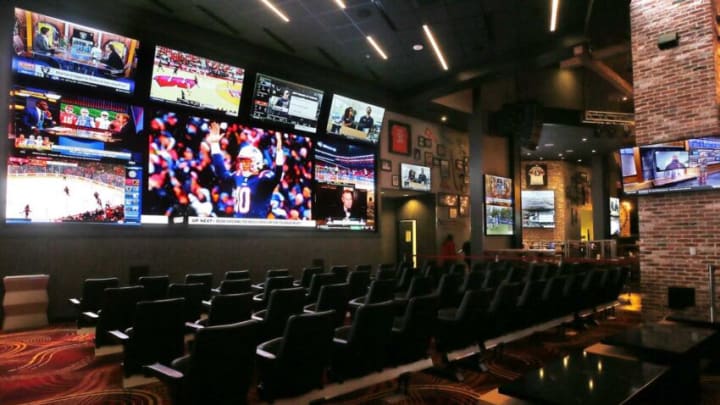 Stadium seating and a mega-sized screen at the new MGM Northfield Park Sportsbook area in Northfield on Thursday.Sportsbook 1