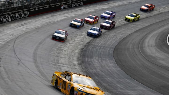 Aug 21, 2016; Bristol, TN, USA; NASCAR Sprint Cup Series driver Kyle Busch (18) leads during the Bass Pro Shops NRA Night Race at Bristol Motor Speedway. Mandatory Credit: Randy Sartin-USA TODAY Sports