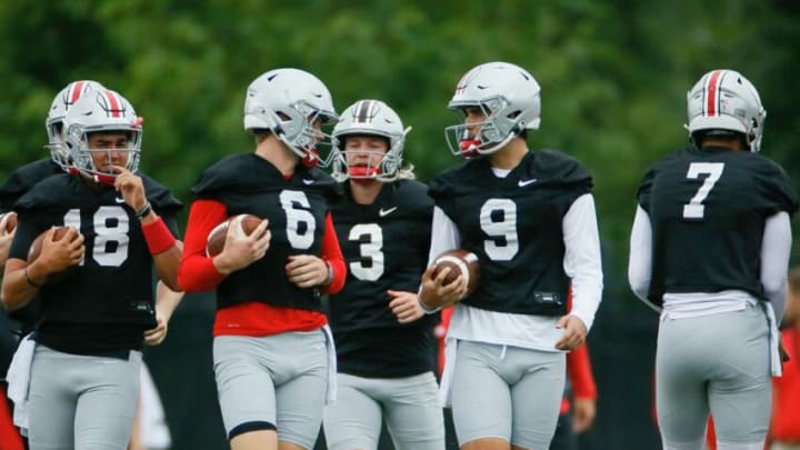 Ohio State Buckeyes quarterbacks Jagger LaRoe (19), J.P. Andrade (18), Kyle McCord (6), Quinn Ewers (3), Jack Miller III (9) and C.J. Stroud (7) warm up during football training camp at the Woody Hayes Athletic Center in Columbus on Wednesday, Aug. 18, 2021.Ohio State Football Training Camp