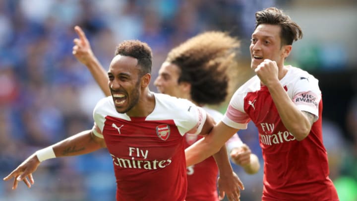 Arsenal's Pierre-Emerick Aubameyang (left) celebrates scoring his side's second goal of the game with Mesut Ozil during the Premier League match at the Cardiff City Stadium. (Photo by Nick Potts/PA Images via Getty Images)