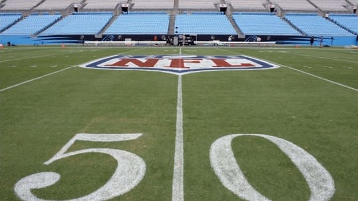 Aug 9, 2013; Charlotte, NC, USA; NFL shield logo on the 50 yard line before the game of the Carolina Panthers and the Chicago Bears at Bank of America Stadium. Mandatory Credit: Sam Sharpe-USA TODAY Sports