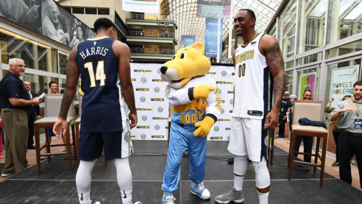 DENVER, CO - AUGUST 8: Darrell Arthur #00 and Gary Harris #14 of the Denver Nuggets and Rocky the Mountain Lion, mascot of the Denver Nuggets, pose for a photo during a jersey launch event on August 8, 2017 at the Denver Performing Arts Center in Denver, Colorado. NOTE TO USER: User expressly acknowledges and agrees that, by downloading and/or using this Photograph, user is consenting to the terms and conditions of the Getty Images License Agreement. Mandatory Copyright Notice: Copyright 2017 NBAE (Photo by Garrett W. Ellwood/NBAE via Getty Images)