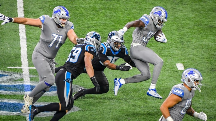 DETROIT, MI – NOVEMBER 18: Detroit Lions running back Kerryon Johnson (33) jumps out of a tackle by Carolina Panthers strong safety Eric Reid (25) during the Detroit Lions versus Carolina Panthers game on Sunday November 18, 2018 at Ford Field in Detroit, MI.(Photo by Steven King/Icon Sportswire via Getty Images)