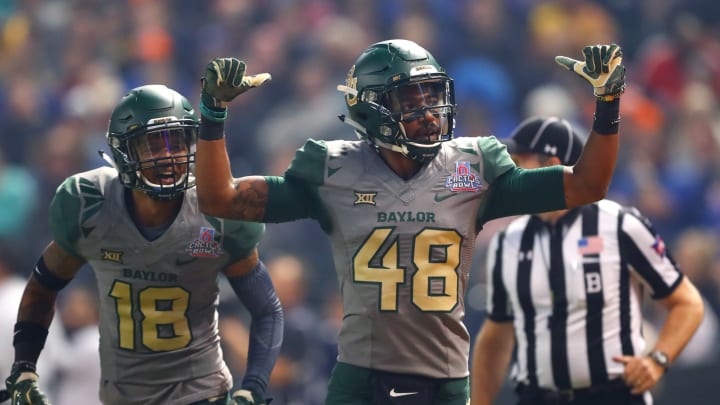 Dec 27, 2016; Phoenix, AZ, USA; Baylor Bears defensive back Travon Blanchard (48) and safety Chance Waz (18) celebrate after an interception against the Boise State Broncos during the Cactus Bowl at Chase Field. Baylor defeated Boise State 31-12. Mandatory Credit: Mark J. Rebilas-USA TODAY Sports
