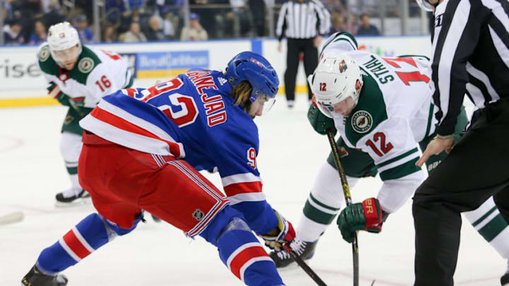 NEW YORK, NY - FEBRUARY 21: New York Rangers Center Mika Zibanejad (93) and Minnesota Wild Center Eric Staal (12) take a face off during the National Hockey League game between the Minnesota Wild and the New York Rangers on February 21, 2019 at Madison Square Garden in New York, NY. (Photo by Joshua Sarner/Icon Sportswire via Getty Images)