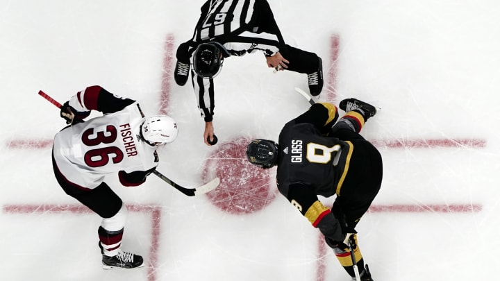 LAS VEGAS, NEVADA – NOVEMBER 29: Christian Fischer #36 of the Arizona Coyotes faces off with Cody Glass #9 of the Vegas Golden Knights during the second period at T-Mobile Arena on November 29, 2019 in Las Vegas, Nevada. (Photo by Jeff Bottari/NHLI via Getty Images)
