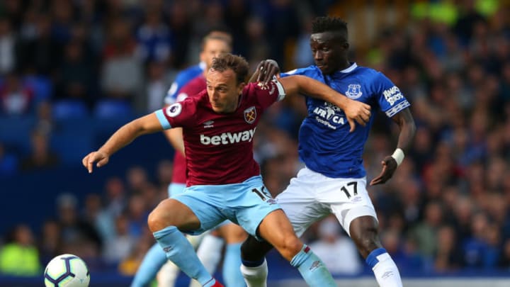 LIVERPOOL, ENGLAND - SEPTEMBER 16: Mark Noble of West Ham United is challenged by Idrissa Gueye of Everton during the Premier League match between Everton FC and West Ham United at Goodison Park on September 16, 2018 in Liverpool, United Kingdom. (Photo by Alex Livesey/Getty Images)