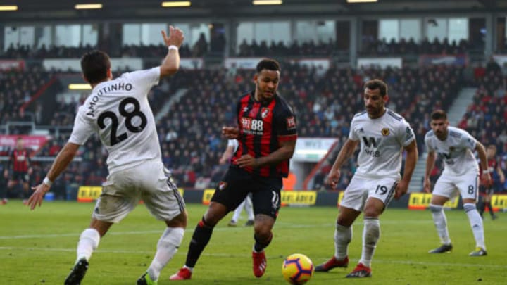 BOURNEMOUTH, ENGLAND – FEBRUARY 23: Joshua King of AFC Bournemouth is challenged by Joao Moutinho of Wolverhampton Wanderers (L) and Jonny Otto of Wolverhampton Wanderers (R) during the Premier League match between AFC Bournemouth and Wolverhampton Wanderers at Vitality Stadium on February 23, 2019, in Bournemouth, United Kingdom. (Photo by Clive Rose/Getty Images)