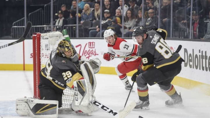 LAS VEGAS, NV - DECEMBER 12: Nate Schmidt #88 and goalie Marc-Andre Fleury #29 of the Vegas Golden Knights defend their goal against the Carolina Hurricanes during the game at T-Mobile Arena on December 12, 2017 in Las Vegas, Nevada. (Photo by David Becker/NHLI via Getty Images)