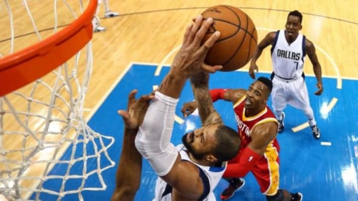 Apr 26, 2015; Dallas, TX, USA; Dallas Mavericks center Tyson Chandler (6) grabs the ball in front of Houston Rockets guard Corey Brewer (33) and center Dwight Howard (12) during game four of the first round of the NBA Playoffs at American Airlines Center. The Mavericks defeated the Rockets 121-109. Mandatory Credit: Ronald Martinez-Pool Photo via USA TODAY Sports