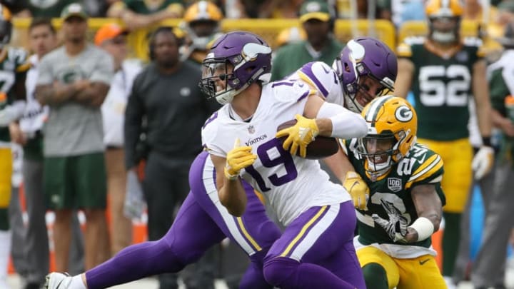 GREEN BAY, WI - SEPTEMBER 16: Adam Thielen #19 of the Minnesota Vikings runs past Jaire Alexander #23 of the Green Bay Packers after making a catch during the first quarter of a game at Lambeau Field on September 16, 2018 in Green Bay, Wisconsin. (Photo by Jonathan Daniel/Getty Images)