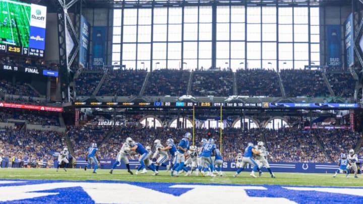 Aug 20, 2022; Indianapolis, Indiana, USA; Detroit Lions quarterback Tim Boyle (12) hands the ball off in the second half against the Indianapolis Colts at Lucas Oil Stadium. Mandatory Credit: Trevor Ruszkowski-USA TODAY Sports