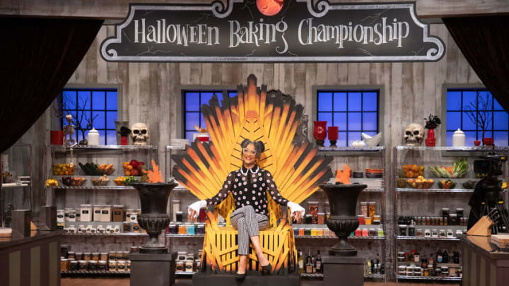 Host Carla in pantry sitting in the throne, as seen on Halloween Baking Championship, Season 6. Photo provided by Food Network
