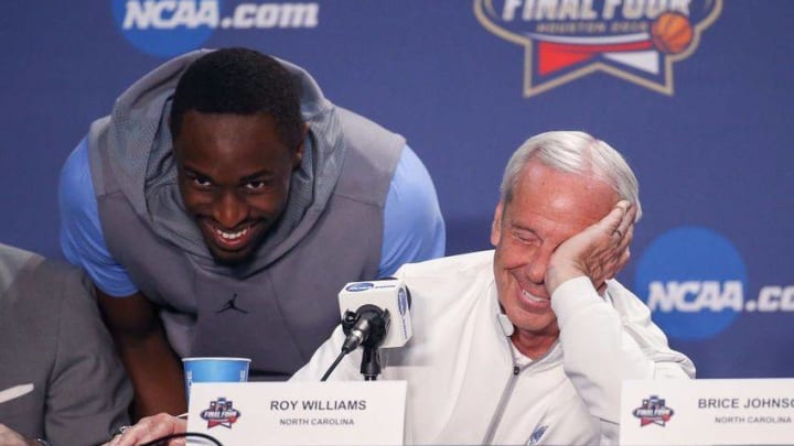 Apr 3, 2016; Houston, TX, USA; North Carolina Tar Heels forward Theo Pinson (left) surprises head coach Roy Williams (right) during a press conference before the national championship game against the Villanova Wildcats at NRG Stadium. Mandatory Credit: Kevin Jairaj-USA TODAY Sports